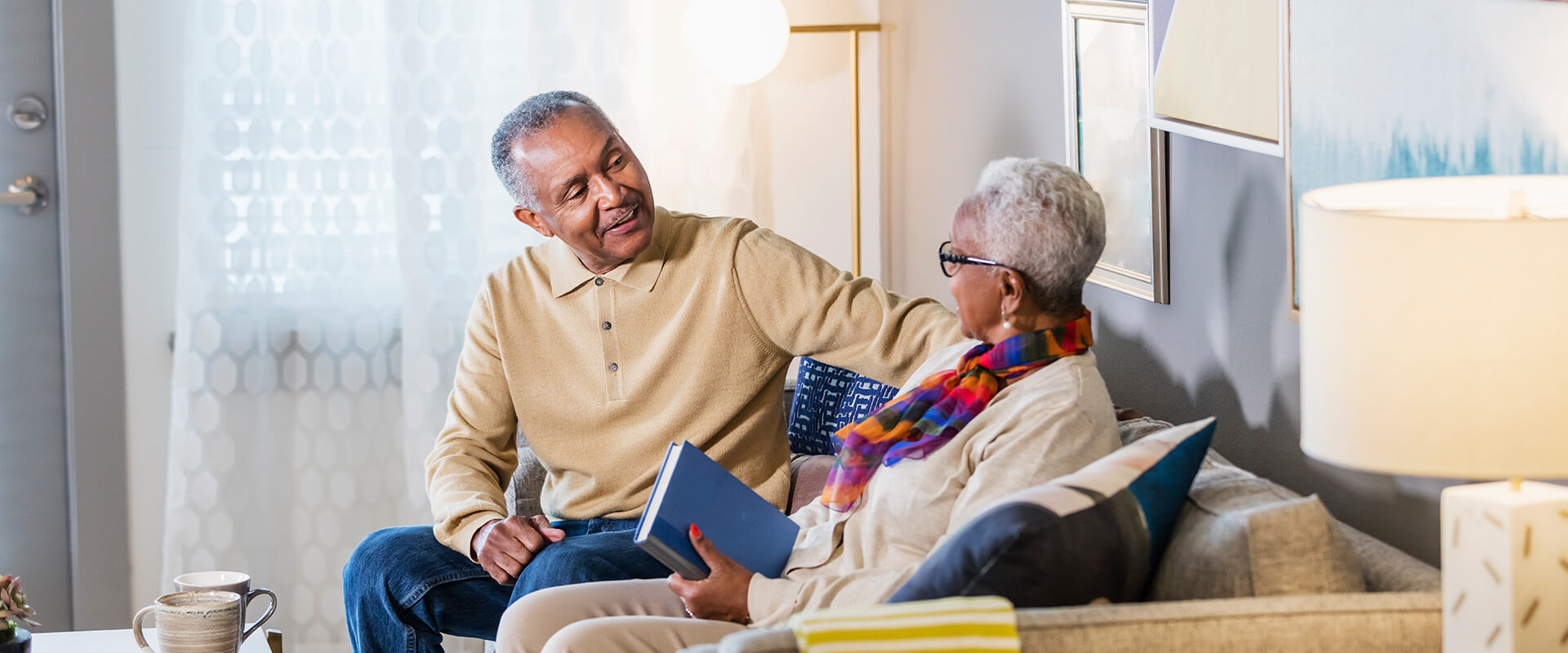 Senior couple having a conversation in their living room