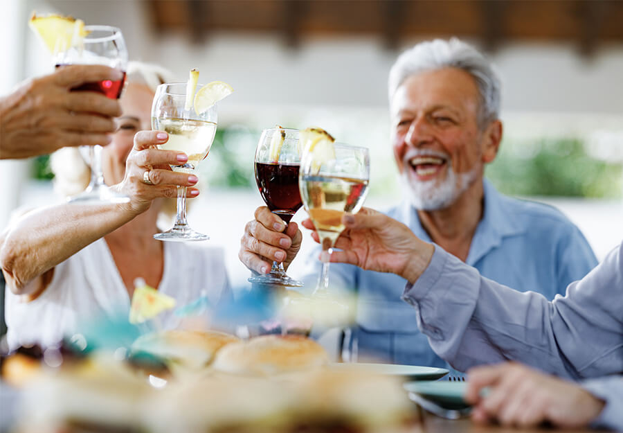 Senior friends celebrate with wine
